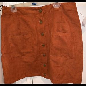 Amber colored skirt, still new, has the tag